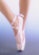 Dancer's feet with ballet shoes on tiptoe