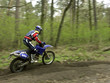 Motocross rider racing on a dirt track
