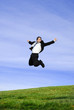 successful and happy young adult businessman jumping