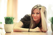Beautiful young woman relaxing in healthy spa cafe.
