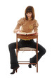 Photo: Young woman with red book on the chair Young woman with red book on the chair