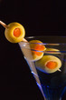 Cocktails, drinks, and alcohol in a colored glass at a bar