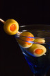 Cocktails, drinks, and alcohol in a colored glass at a bar