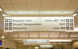 Direction signs in an airport terminal for travelers Direction signs in an airport terminal for travelers