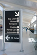 Direction signs in an airport terminal for travelers Direction signs in an airport terminal for travelers