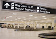 Direction signs in an airport terminal for travelers Direction signs in an airport terminal for travelers