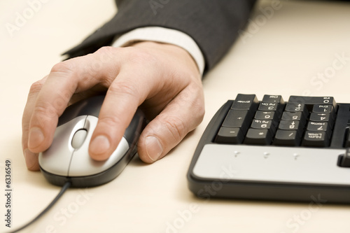 Photo: man holding a mouse man holding a mouse