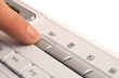 Finger pressing send e-mail button.