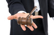 legal concept with businessman holding a gavel on white