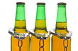 Drunk driving concept - bottled beer and handcuffs.