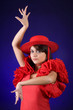Classic pose of a young Spanish flamenco dancer
