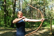 Girl-archer in the forest