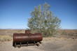 Oil tank and a tree in the desert