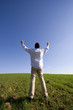 man outstretched to the blue sky (with copyspace)