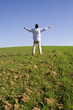 man outstretched to the blue sky (with copyspace)