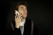 A guy talking on the IPhone