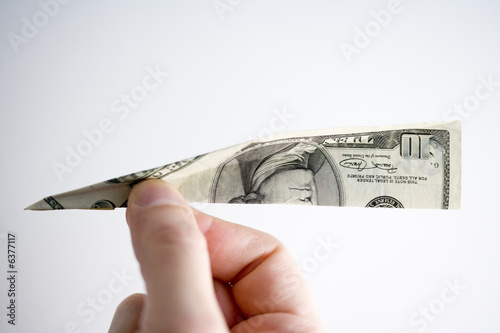 Photo: a paper plane made of a dollar note a paper plane made of a dollar note