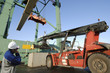 port worker and giant forklift