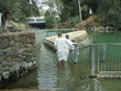 People baptizing in Jordan River in Israel People baptizing in Jordan River in Israel