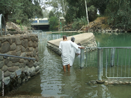 People baptizing in Jordan River in Israel