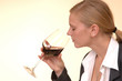 Woman tasting wine