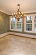 empty diningroom with lots of windows and view of lake