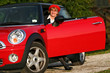 Senior in a red sports car (MINI Cooper) Senior in a red sports car (MINI Cooper)