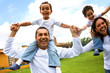 happy family smiling and having fun outdoors