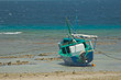.Boat of fisherman to the port with low tide