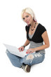 Beautiful blond girl on her laptop computer isolated on white