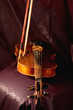 Old violin on dark backgrounds, focus on bridge
