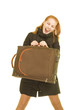 Photo: happy young woman with a suitcase in her hand happy young woman with a suitcase in her hand