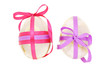 Two egg shaped semiprecious gemstones decorated for Easter