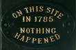 Metal plaque with "Nothing happened here" message