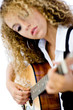 Young teenage woman with a guitar (shallow depth of field used)