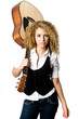 An attractive young teenage woman with an acoustic guitar 