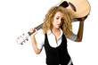 An attractive young teenage woman with an acoustic guitar 