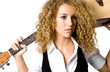 An attractive young teenage woman with an acoustic guitar 