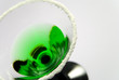 Green cocktail with salted rim in Art Deco glass