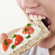 young beautiful caucasian woman eating a rusk young beautiful caucasian woman eating a rusk