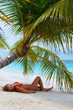 Cute Girl is relaxing on the beach. Fashion holidays.