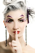 Beautiful woman with artistic make-up asks to keep silence