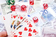 Poker hands - cards have focus with poker chips and money