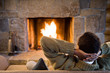 Man relaxing infront of fire