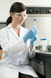 A scientist inspecting a test tube