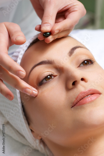 Photo: skin treatment applying skin treatment applying