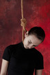 Suicide. Hanging on rope.