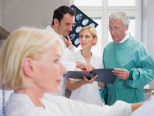 Hospital staff looking at a file Hospital staff looking at a file