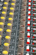 soundboard mixer dials and lights
