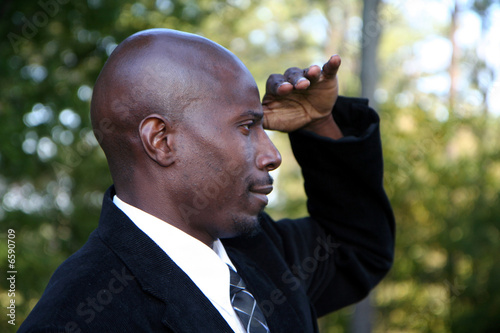 Photo: Businessman Looking to Distance Businessman Looking to Distance